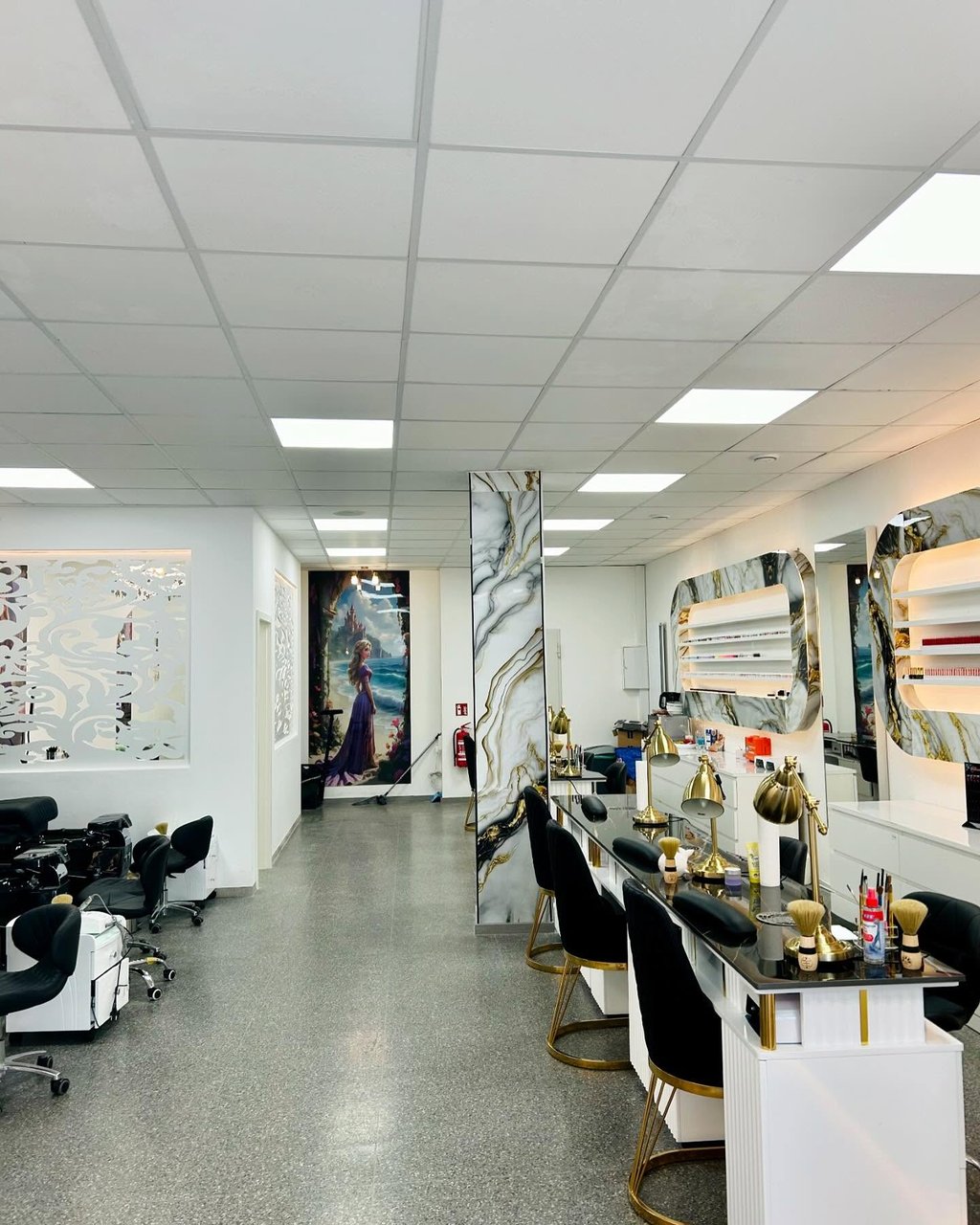 View into the salon with manicure tables